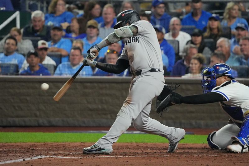 Oct 10, 2024; Kansas City, Missouri, USA; New York Yankees second baseman Gleyber Torres (25) hits an RBI single during the fifth inning against the Kansas City Royals during game four of the ALDS for the 2024 MLB Playoffs at Kauffman Stadium. Mandatory Credit: Denny Medley-Imagn Images