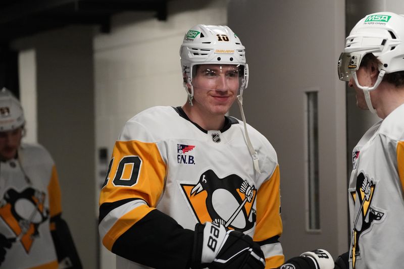 Jan 27, 2025; San Jose, California, USA;  Pittsburgh Penguins left winger Drew O'Connor (10) during pre-game warms up against the San Jose Sharks at SAP Center at San Jose. Mandatory Credit: David Gonzales-Imagn Images