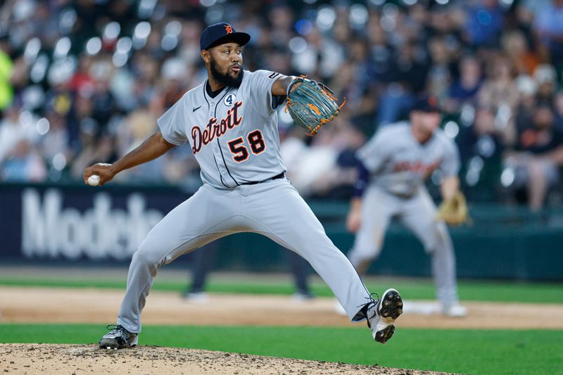 Jun 2, 2025; Chicago, Illinois, USA; Detroit Tigers relief pitcher Dylan Smith (58) delivers a pitch against the Chicago White Sox during the seventh inning at Rate Field. Mandatory Credit: Kamil Krzaczynski-Imagn Images
