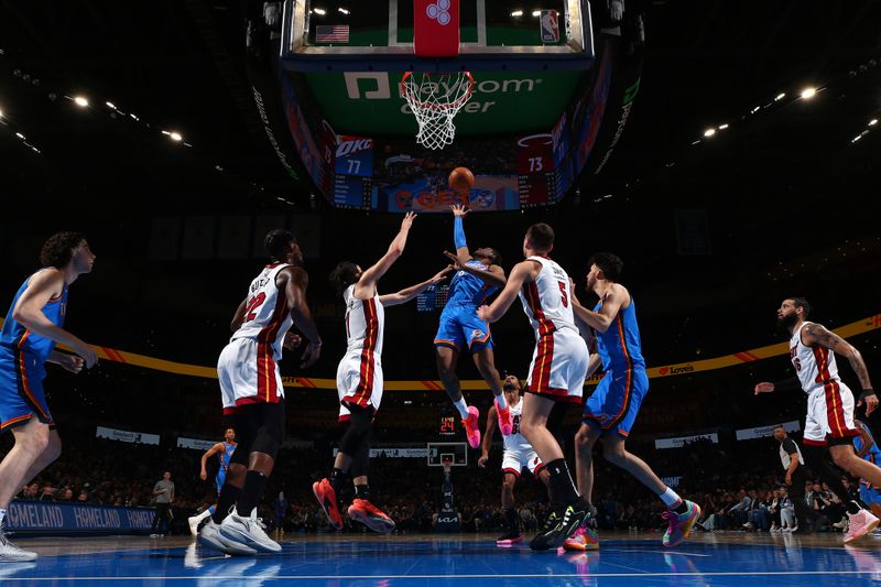 OKLAHOMA CITY, OK - MARCH 8:  Jalen Williams #8 of the Oklahoma City Thunder reaches for the ball during the game against the Miami Heat on March 8, 2024 at Paycom Arena in Oklahoma City, Oklahoma. NOTE TO USER: User expressly acknowledges and agrees that, by downloading and or using this photograph, User is consenting to the terms and conditions of the Getty Images License Agreement. Mandatory Copyright Notice: Copyright 2024 NBAE (Photo by Zach Beeker/NBAE via Getty Images)