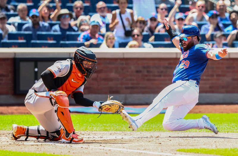 May 26, 2024; New York City, New York, USA;  New York Mets right fielder DJ Stewart (29) slides safely past the tag of San Francisco Giants catcher Patrick Bailey (14) in the second inning at Citi Field. Mandatory Credit: Wendell Cruz-USA TODAY Sports