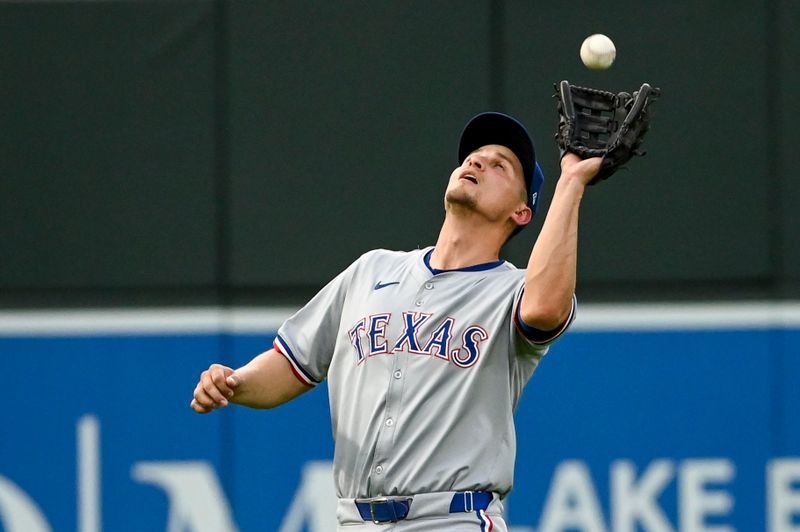 Jun 29, 2024; Baltimore, Maryland, USA;  Texas Rangers shortstop Corey Seager (5) catches third inning fly ball against the Baltimore Orioles at Oriole Park at Camden Yards. Mandatory Credit: Tommy Gilligan-USA TODAY Sports