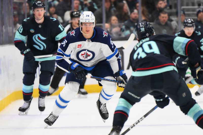 Mar 8, 2024; Seattle, Washington, USA; Winnipeg Jets center Morgan Barron (36) defends Seattle Kraken defenseman Ryker Evans (39) during the third period at Climate Pledge Arena. Mandatory Credit: Steven Bisig-USA TODAY Sports