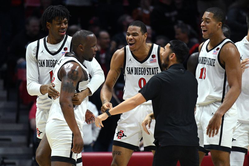 Jan 25, 2023; San Diego, California, USA; San Diego State Aztecs guard Adam Seiko (2) is congratulated after a three-point basket during the first half against the Utah State Aggies at Viejas Arena. Mandatory Credit: Orlando Ramirez-USA TODAY Sports