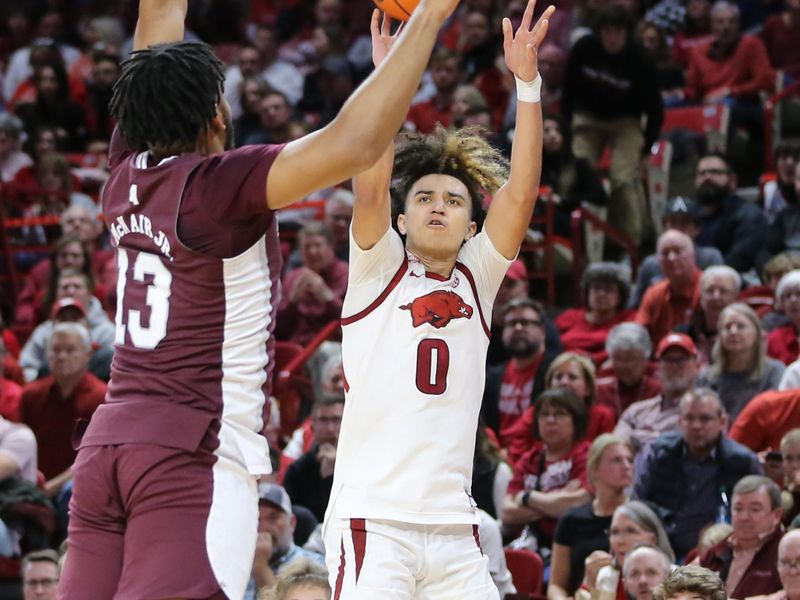 Feb 11, 2023; Fayetteville, Arkansas, USA; Arkansas Razorbacks guard Anthony Black (0) shoots over Mississippi State Bulldogs forward Will McNair Jr (13) during the first half at Bud Walton Arena. Mandatory Credit: Nelson Chenault-USA TODAY Sports