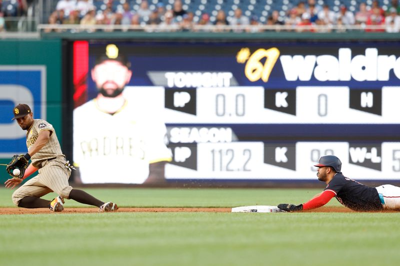 Jul 24, 2024; Washington, District of Columbia, USA; Washington Nationals second baseman Luis García Jr. (2) steals second base ahead of an attempted tag by San Diego Padres second baseman Xander Bogaerts (2) during the first inning at Nationals Park. Mandatory Credit: Geoff Burke-USA TODAY Sports