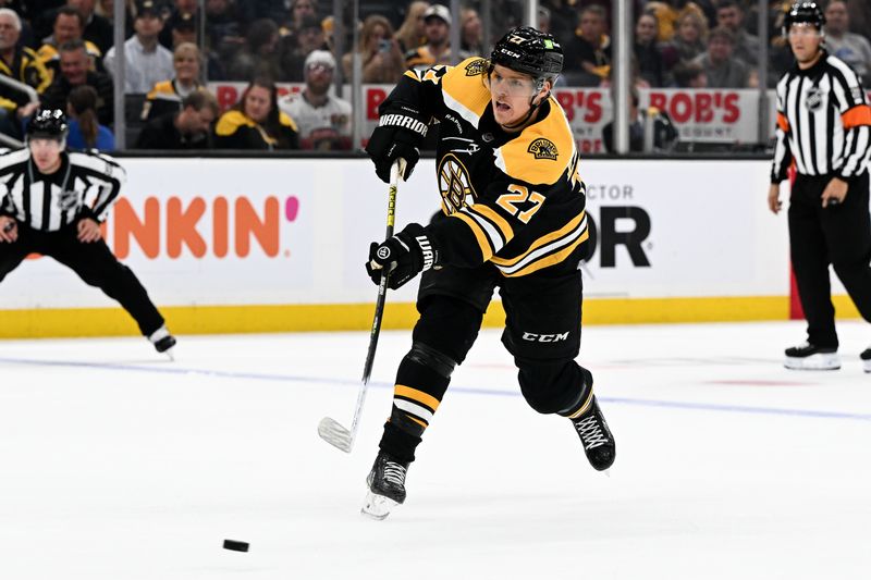 Oct 17, 2022; Boston, Massachusetts, USA; Boston Bruins defenseman Hampus Lindholm (27) attempts a shot against the Florida Panthers during the first period at the TD Garden. Mandatory Credit: Brian Fluharty-USA TODAY Sports