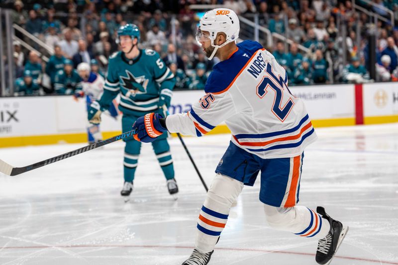 Feb 28, 2026; San Jose, California, USA; Edmonton Oilers defenseman Darnell Nurse (25) shoots on goal against the San Jose Sharks during the first period at SAP Center at San Jose. Mandatory Credit: Neville E. Guard-Imagn Images