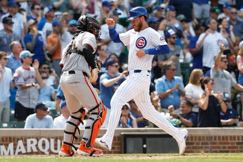 Jun 19, 2024; Chicago, Illinois, USA; Chicago Cubs outfielder Cody Bellinger (24) scores against the San Francisco Giants during the seventh inning at Wrigley Field. Mandatory Credit: Kamil Krzaczynski-USA TODAY Sports