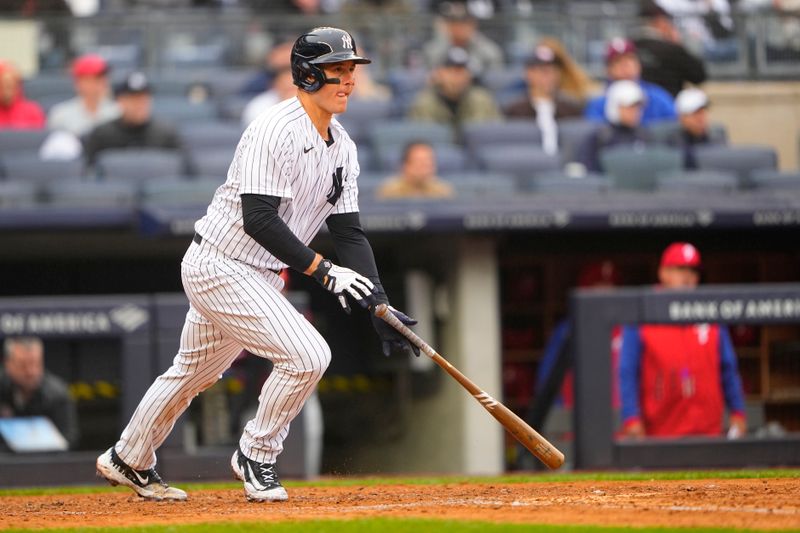 Apr 5, 2023; Bronx, New York, USA; New York Yankees first baseman Anthony Rizzo (48) hits a single against the Philadelphia Phillies during the fourth inning at Yankee Stadium. Mandatory Credit: Gregory Fisher-USA TODAY Sports