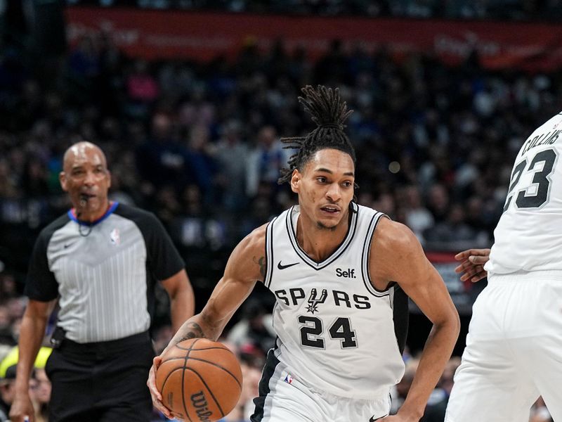 DALLAS, TX - FEBRUARY 14: Devin Vassell #24 of the San Antonio Spurs handles the ball during the game against the Dallas Mavericks on February 14, 2024 at the American Airlines Center in Dallas, Texas. NOTE TO USER: User expressly acknowledges and agrees that, by downloading and or using this photograph, User is consenting to the terms and conditions of the Getty Images License Agreement. Mandatory Copyright Notice: Copyright 2024 NBAE (Photo by Glenn James/NBAE via Getty Images)