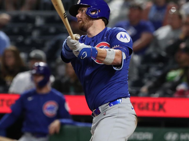 Apr 29, 2025; Pittsburgh, Pennsylvania, USA;  Chicago Cubs catcher Carson Kelly (15) hits a single against the Pittsburgh Pirates during the seventh inning at PNC Park. Mandatory Credit: Charles LeClaire-Imagn Images