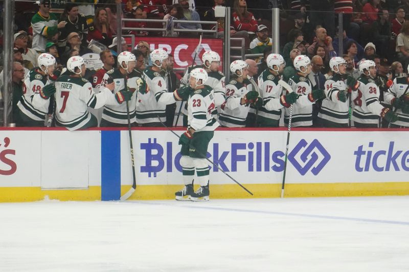 Oct 4, 2024; Chicago, Illinois, USA; Minnesota Wild center Marco Rossi (23) celebrates his goal against the Chicago Blackhawks during the first period at United Center. Mandatory Credit: David Banks-Imagn Images