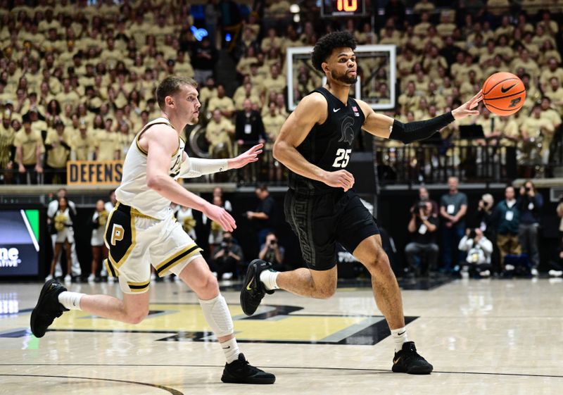 Mar 2, 2024; West Lafayette, Indiana, USA; Michigan State Spartans forward Malik Hall (25) passes the ball away from Purdue Boilermakers guard Braden Smith (3) during the first half at Mackey Arena. Mandatory Credit: Marc Lebryk-USA TODAY Sports