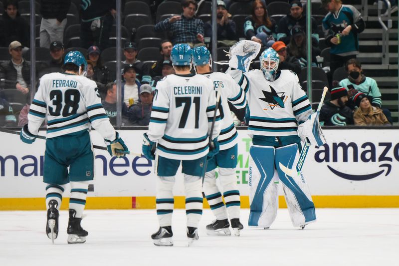 Nov 5, 2025; Seattle, Washington, USA; San Jose Sharks goaltender Yaroslav Askarov (30) celebrates with the team after defeating the Seattle Kraken during the third period at Climate Pledge Arena. Mandatory Credit: Steven Bisig-Imagn Images