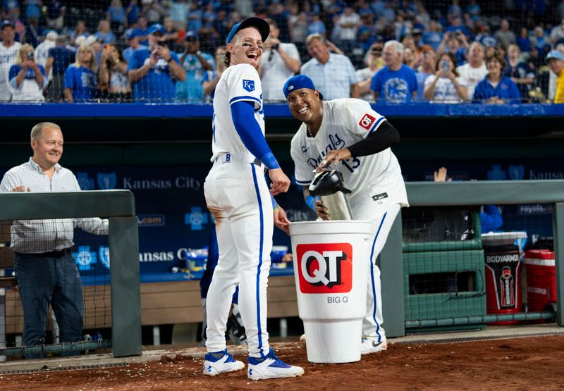 Aug 21, 2024; Kansas City, Missouri, USA; Kansas City Royals shortstop Bobby Witt Jr. (7) and catcher Salvador Perez (13) get ready to splash left fielder MJ Melendez (not pictured) after defeating the Los Angeles Angels at Kauffman Stadium. Mandatory Credit: Jay Biggerstaff-USA TODAY Sports