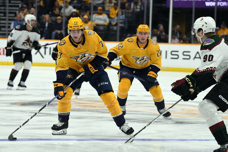 Nov 11, 2023; Nashville, Tennessee, USA; Nashville Predators right wing Luke Evangelista (77) skates the puck into the offensive zone during the first period against the Arizona Coyotes at Bridgestone Arena. Mandatory Credit: Christopher Hanewinckel-USA TODAY Sports