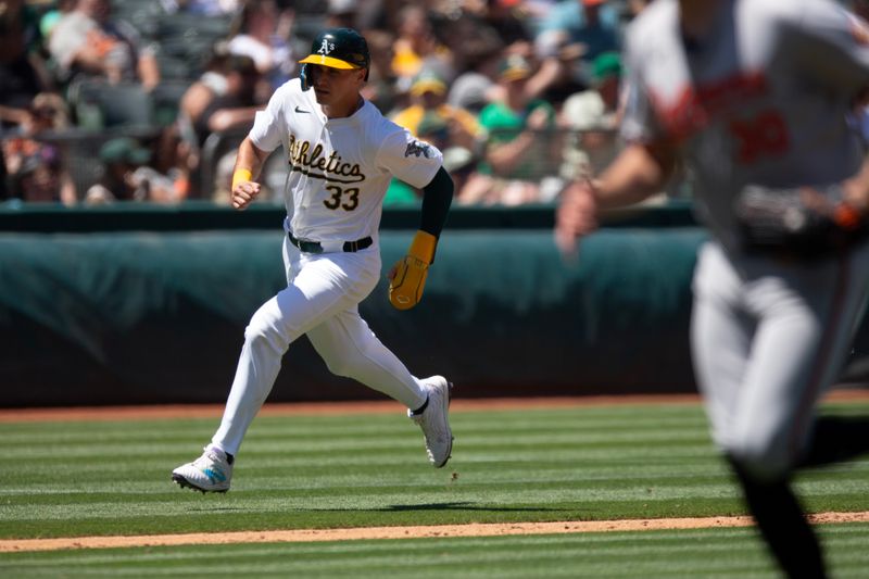 Jul 7, 2024; Oakland, California, USA; Oakland Athletics center fielder JJ Bleday (33) rounds third and scores on a single by Tyler Soderstrom against the Baltimore Orioles during the sixth inning at Oakland-Alameda County Coliseum. Mandatory Credit: D. Ross Cameron-USA TODAY Sports