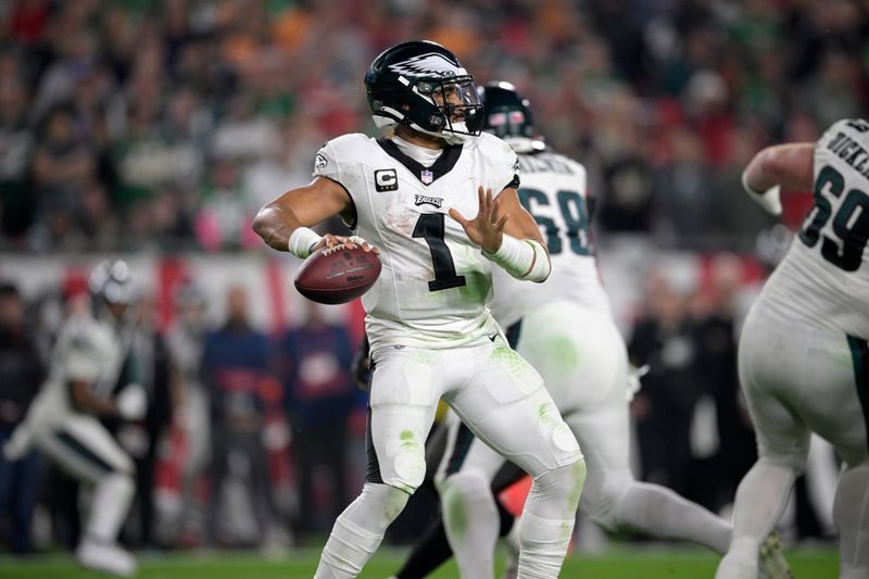 Philadelphia Eagles quarterback Jalen Hurts (1) throws a pass during the second half of an NFL wild-card playoff football game against the Tampa Bay Buccaneers, Monday, Jan. 15, 2024, in Tampa, Fla. (AP Photo/Phelan M. Ebenhack)