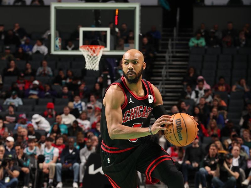 CHARLOTTE, NC - JANUARY 31: Jevon Carter #5 of the Chicago Bulls handles the ball during the game against the Charlotte Hornets on January 31, 2024 at Spectrum Center in Charlotte, North Carolina. NOTE TO USER: User expressly acknowledges and agrees that, by downloading and or using this photograph, User is consenting to the terms and conditions of the Getty Images License Agreement. Mandatory Copyright Notice: Copyright 2024 NBAE (Photo by Kent Smith/NBAE via Getty Images) 