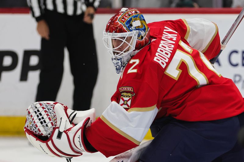 Oct 17, 2024; Sunrise, Florida, USA; Florida Panthers goaltender Sergei Bobrovsky (72) defends his net against the Vancouver Canucks during the second period at Amerant Bank Arena. Mandatory Credit: Sam Navarro-Imagn Images