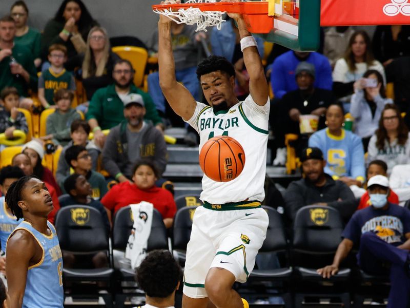 Dec 21, 2025; Waco, Texas, USA; Baylor Bears center Caden Powell (44) dunks the ball against the Southern University Jaguars during the first half at Paul and Alejandra Foster Pavilion. Mandatory Credit: Chris Jones-Imagn Images