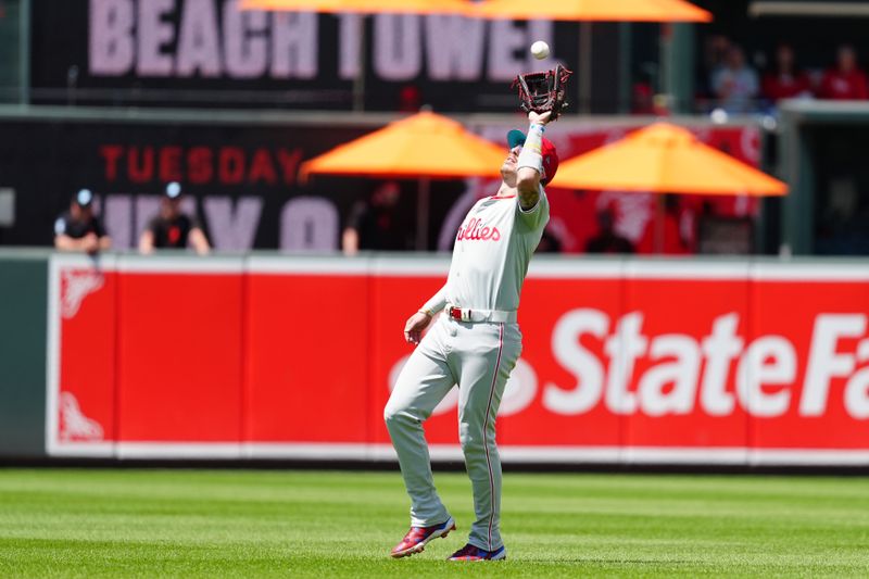 Jun 16, 2024; Baltimore, Maryland, USA; Philadelphia Phillies second baseman Bryson Stott (5) catches a fly ball hit by Baltimore Orioles right fielder Anthony Santander (not pictured) during the third inning at Oriole Park at Camden Yards. Mandatory Credit: Gregory Fisher-USA TODAY Sports