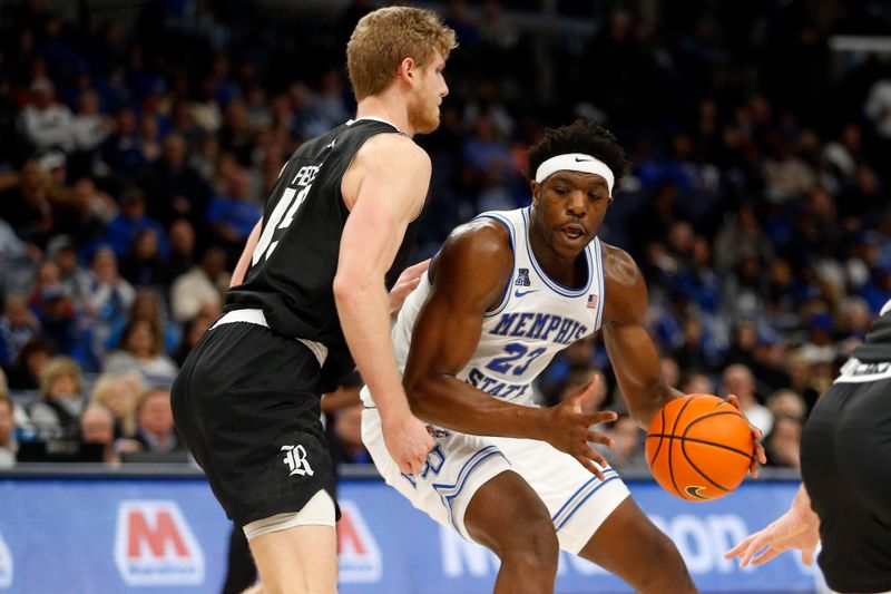 Jan 31, 2024; Memphis, Tennessee, USA; Memphis Tigers forward Malcolm Dandridge (23) drives to the basket as Rice Owls forward Max Fiedler (15) defends during the first half at FedExForum. Mandatory Credit: Petre Thomas-USA TODAY Sports