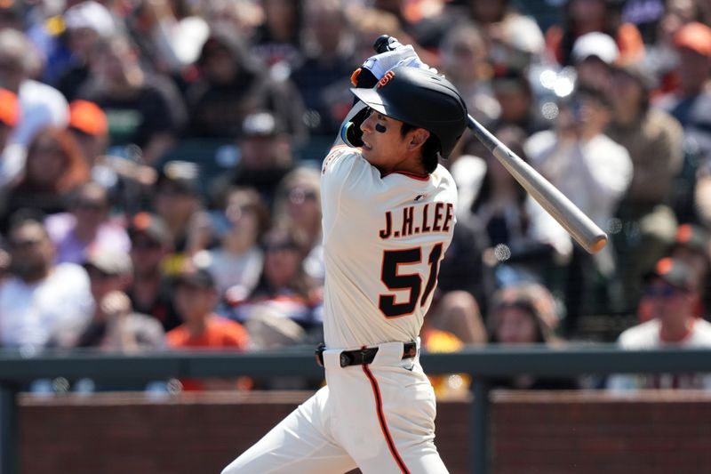 May 3, 2025; San Francisco, California, USA; San Francisco Giants center fielder Jung Hoo Lee (51) hits an RBI single against the Colorado Rockies during the sixth inning at Oracle Park. Mandatory Credit: Darren Yamashita-Imagn Images