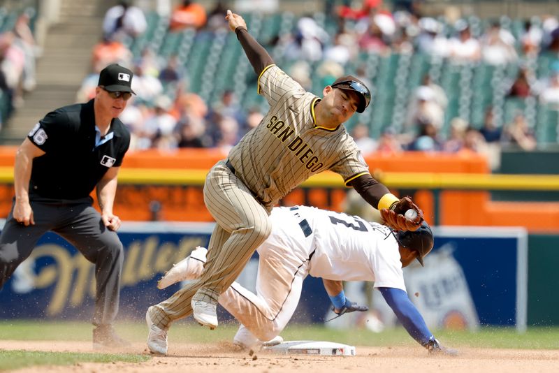 Apr 23, 2025; Detroit, Michigan, USA;  Detroit Tigers third baseman Andy Ibanez (77) steals second ahead of the throw to San Diego Padres second baseman Jose Iglesias (7) in the sixth inning at Comerica Park. Mandatory Credit: Rick Osentoski-Imagn Images
