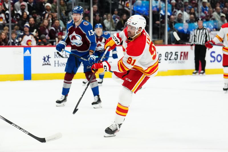 Dec 11, 2023; Denver, Colorado, USA; Calgary Flames center Nazem Kadri (91) shoots and scores in the first period against the Colorado Avalanche at Ball Arena. Mandatory Credit: Ron Chenoy-USA TODAY Sports