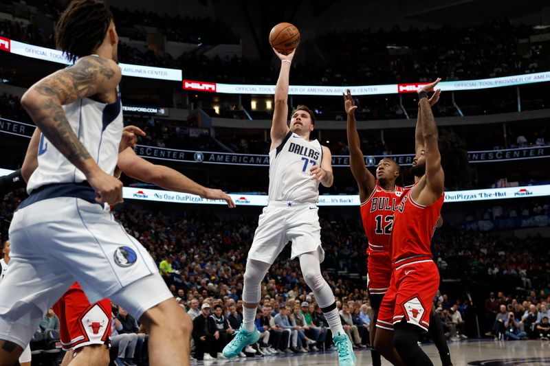 DALLAS, TEXAS - NOVEMBER 01: Luka Doncic #77 of the Dallas Mavericks shoots the ball against Ayo Dosunmu #12 of the Chicago Bulls in the first half at American Airlines Center on November 01, 2023 in Dallas, Texas. NOTE TO USER: User expressly acknowledges and agrees that, by downloading and or using this photograph, User is consenting to the terms and conditions of the Getty Images License Agreement. (Photo by Tim Heitman/Getty Images)