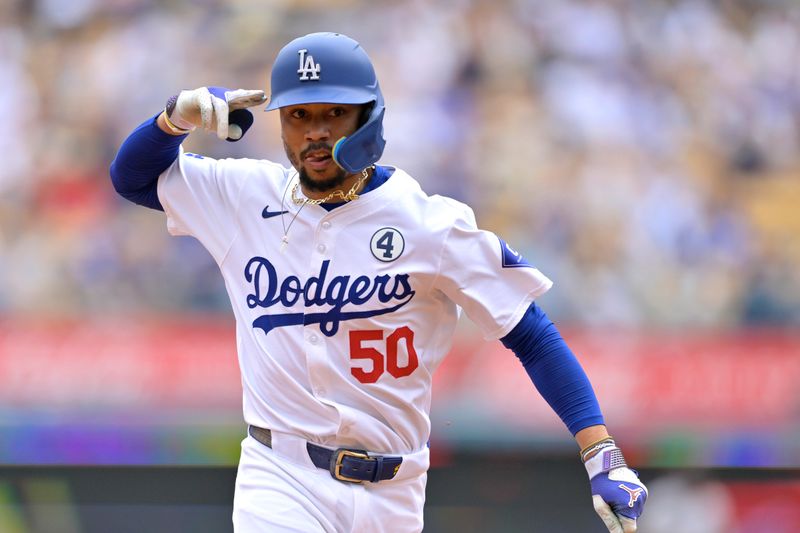 Jun 2, 2024; Los Angeles, California, USA;  Los Angeles Dodgers shortstop Mookie Betts (50) rounds the bases after hitting a solo home run in the first inning against the Colorado Rockies at Dodger Stadium. Mandatory Credit: Jayne Kamin-Oncea-USA TODAY Sports