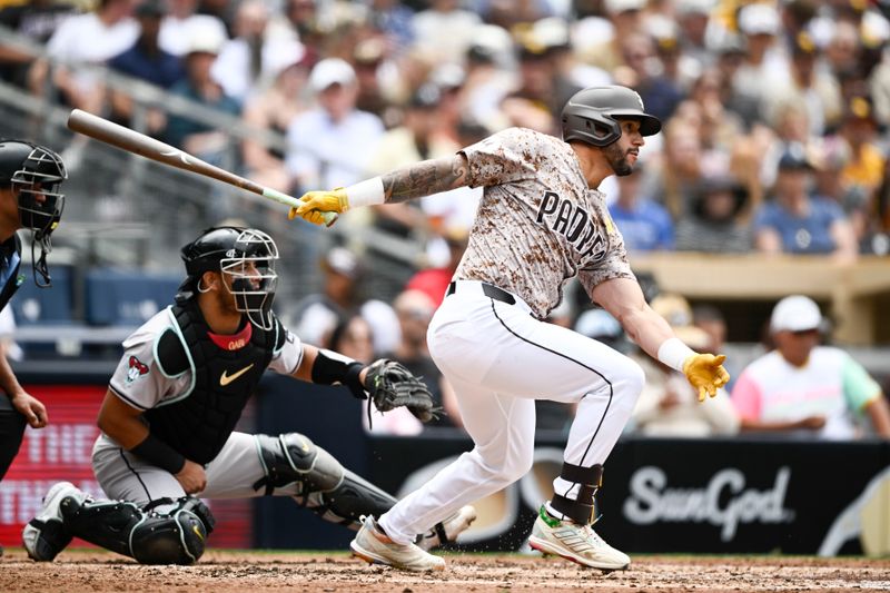 Jun 9, 2024; San Diego, California, USA; San Diego Padres right fielder David Peralta (24) hits a single during the second inning against the Arizona Diamondbacks at Petco Park. Mandatory Credit: Denis Poroy-USA TODAY Sports at Petco Park. 