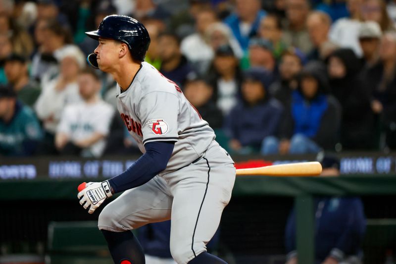 Apr 2, 2024; Seattle, Washington, USA; Cleveland Guardians right fielder Will Brennan (17) hits a single against the Seattle Mariners during the fourth inning at T-Mobile Park. Mandatory Credit: Joe Nicholson-USA TODAY Sports