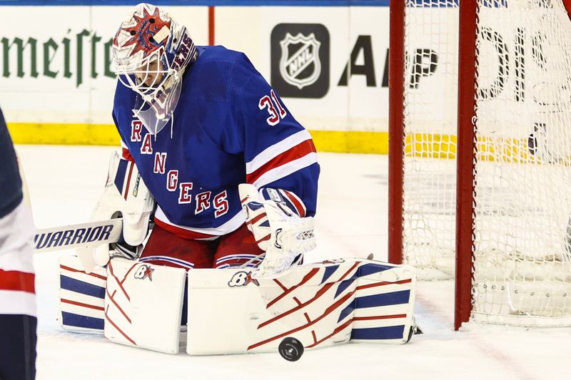 Apr 21, 2024; New York, New York, USA; New York Rangers goaltender Igor Shesterkin (31) makes a save on a shot on goal attempt in the third period against the Washington Capitals in game one of the first round of the 2024 Stanley Cup Playoffs at Madison Square Garden. Mandatory Credit: Wendell Cruz-USA TODAY Sports