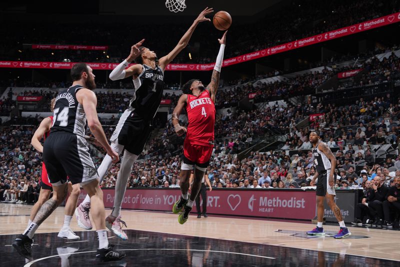 SAN ANTONIO, TX - MARCH 12: Jalen Green #4 of the Houston Rockets drives to the basket during the game against the San Antonio Spurs on March 12, 2024 at the Frost Bank Center in San Antonio, Texas. NOTE TO USER: User expressly acknowledges and agrees that, by downloading and or using this photograph, user is consenting to the terms and conditions of the Getty Images License Agreement. Mandatory Copyright Notice: Copyright 2024 NBAE (Photos by Jesse D. Garrabrant/NBAE via Getty Images)