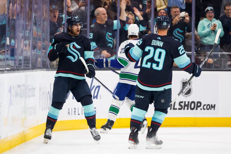 Oct 1, 2022; Seattle, Washington, USA; Seattle Kraken center Matty Beniers (10) celebrates after scoring a goal against the Vancouver Canucks during the second period at Climate Pledge Arena. Mandatory Credit: Joe Nicholson-USA TODAY Sports