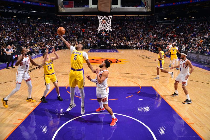 PHOENIX, AZ - OCTOBER 17: Cam Reddish #5 of the Los Angeles Lakers goes up for the rebound during the game against the Phoenix Suns during a NBA Preseason game on October 17, 2024 at Footprint Center in Phoenix, Arizona. NOTE TO USER: User expressly acknowledges and agrees that, by downloading and or using this photograph, user is consenting to the terms and conditions of the Getty Images License Agreement. Mandatory Copyright Notice: Copyright 2024 NBAE (Photo by Barry Gossage/NBAE via Getty Images)