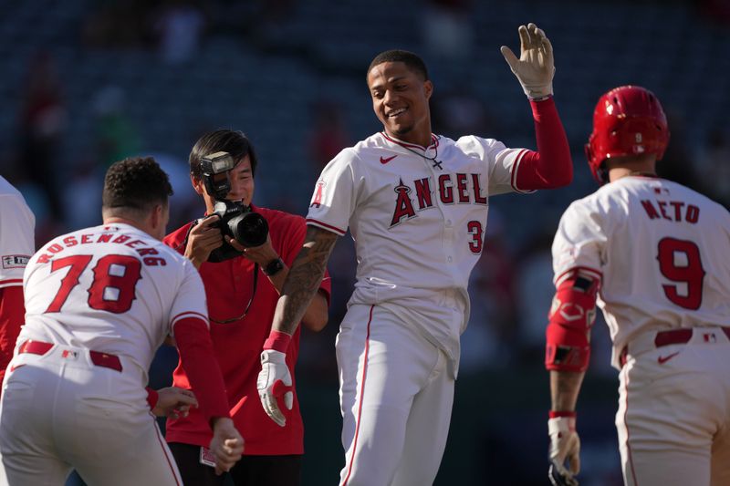 Sep 18, 2024; Anaheim, California, USA; Los Angeles Angels center fielder Jordyn Aadams (39) celebrates with shortstop Zach Neto (9) after hitting a walkoff single in the 13th inning against the Chicago White Sox at Angel Stadium. Mandatory Credit: Kirby Lee-Imagn Images