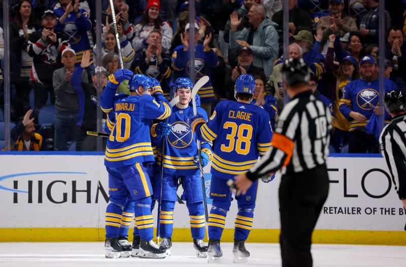 Apr 11, 2024; Buffalo, New York, USA;  Buffalo Sabres left wing Zach Benson (9) celebrates his goal with teammates during the first period against the Washington Capitals at KeyBank Center. Mandatory Credit: Timothy T. Ludwig-USA TODAY Sports