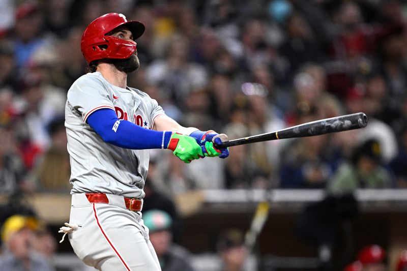 Apr 26, 2024; San Diego, California, USA; Philadelphia Phillies first baseman Bryce Harper (3) hits a home run against the San Diego Padres during the third inning at Petco Park. Mandatory Credit: Orlando Ramirez-USA TODAY Sports