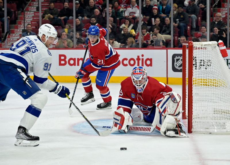 Nov 7, 2023; Montreal, Quebec, CAN; Montreal Canadiens goalie Sam Montembeault (35) stops Tampa Bay Lightning forward Steven Stamkos (91) during the second period at the Bell Centre. Mandatory Credit: Eric Bolte-USA TODAY Sports