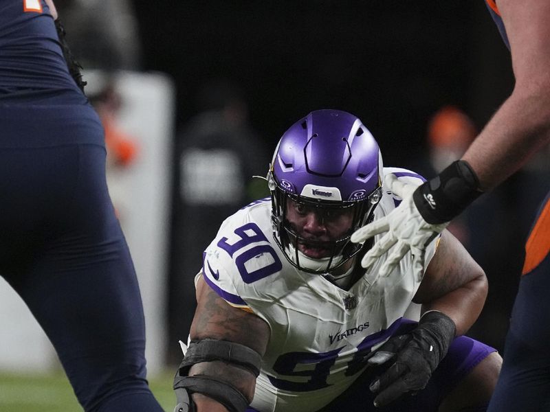 Minnesota Vikings defensive end Jonathan Bullard (90) against the Denver Broncos of an NFL football game Sunday November 19, 2023, in Denver. (AP Photo/Bart Young)