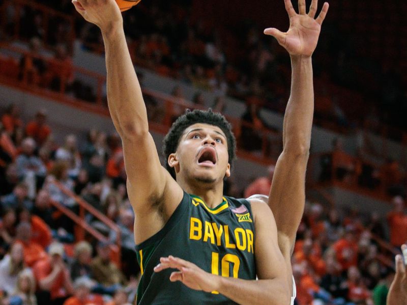 Jan 6, 2024; Stillwater, Oklahoma, USA; Baylor Bears guard RayJ Dennis (10) puts up a shot during overtime against the Oklahoma State Cowboys at Gallagher-Iba Arena. Mandatory Credit: William Purnell-USA TODAY Sports