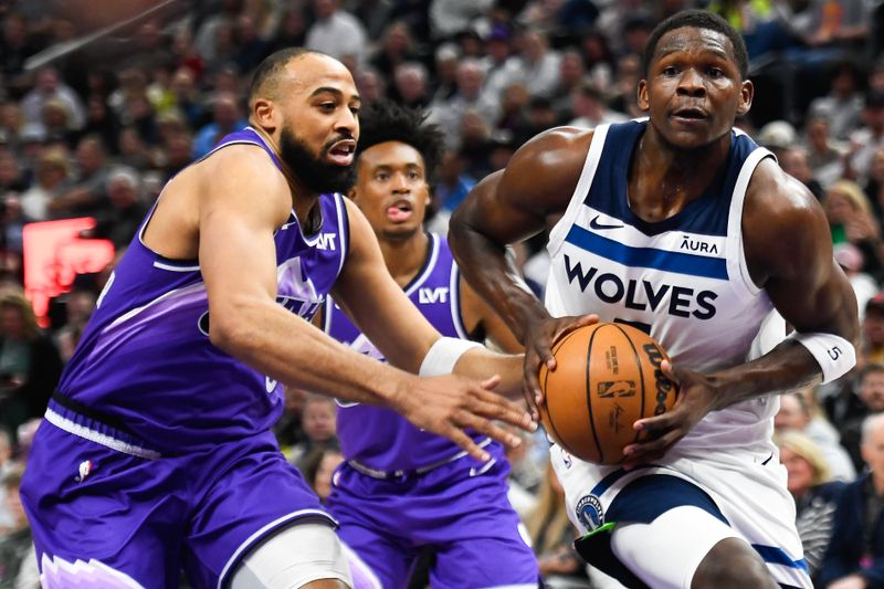 SALT LAKE CITY, UTAH - MARCH 18: Anthony Edwards #5 of the Minnesota Timberwolves drives past Talen Horton-Tucker #5 of the Utah Jazz during the first half of a game at Delta Center on March 18, 2024 in Salt Lake City, Utah. NOTE TO USER: User expressly acknowledges and agrees that, by downloading and or using this photograph, User is consenting to the terms and conditions of the Getty Images License Agreement.  (Photo by Alex Goodlett/Getty Images)