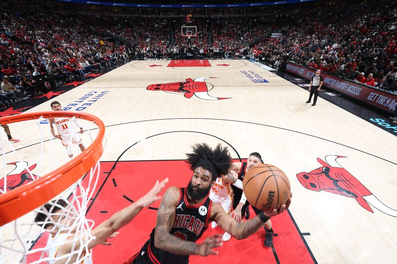 CHICAGO, IL - APRIL 17:  Coby White #0 of the Chicago Bulls goes to the basket during the game against the Atlanta Hawks during the 2024 Play-In Tournament  on April 17, 2024 at United Center in Chicago, Illinois. NOTE TO USER: User expressly acknowledges and agrees that, by downloading and or using this photograph, User is consenting to the terms and conditions of the Getty Images License Agreement. Mandatory Copyright Notice: Copyright 2024 NBAE (Photo by Jeff Haynes/NBAE via Getty Images)