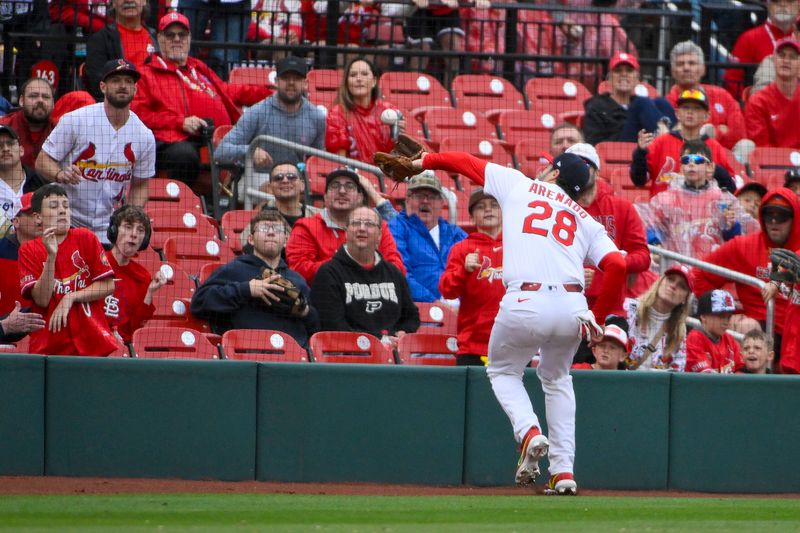 May 25, 2025; St. Louis, Missouri, USA;  St. Louis Cardinals third baseman Nolan Arenado (28) catches a foul ball hit by Arizona Diamondbacks second baseman Ketel Marte (not pictured) during the ninth inning at Busch Stadium. Mandatory Credit: Jeff Curry-Imagn Images