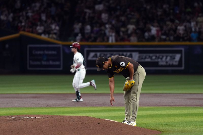 Sep 27, 2024; Phoenix, Arizona, USA; San Diego Padres pitcher Yu Darvish (11) reacts after allowing a solo home run to Arizona Diamondbacks catcher Jose Herrera (11) during the first inning at Chase Field. Mandatory Credit: Joe Camporeale-Imagn Images