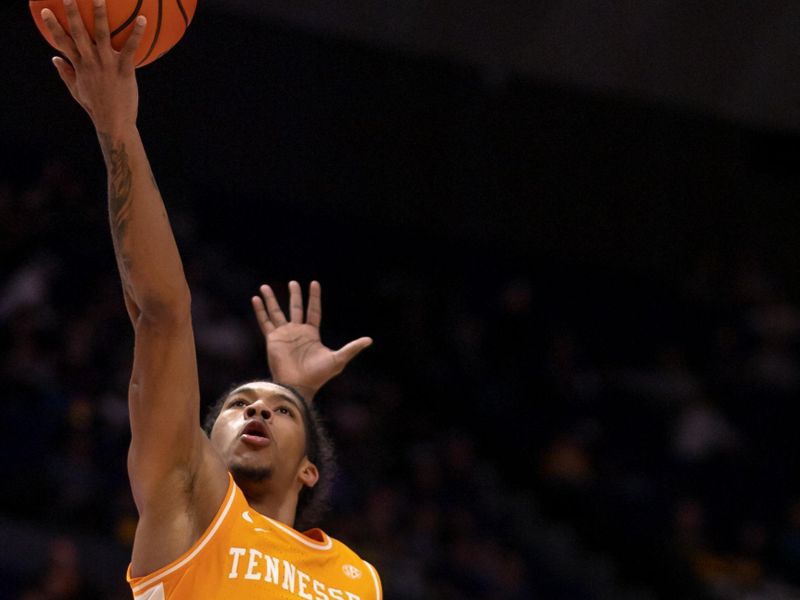 Jan 21, 2023; Baton Rouge, Louisiana, USA; Tennessee Volunteers guard Zakai Zeigler (5) drives to the basket against LSU Tigers guard Cam Hayes (1) during the second half at Pete Maravich Assembly Center. Mandatory Credit: Stephen Lew-USA TODAY Sports